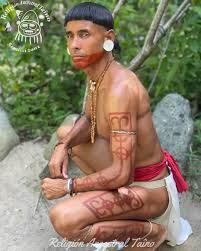 Taíno warrior with body paint and tattoos